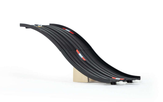 Black curved track section with road markings and raised ramp base
