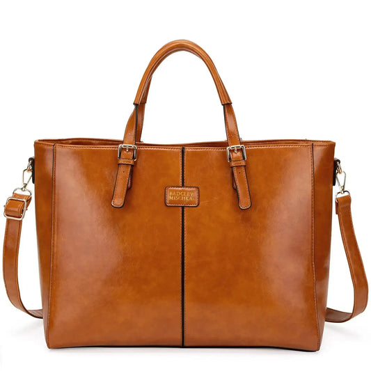 Tan vegan leather weekender bag with two front pockets and top handles, crossbody strap