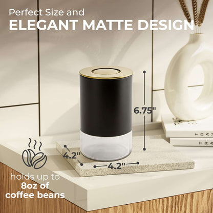 Matte black round storage container with stainless lid and clear glass container body