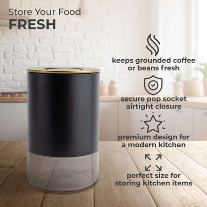 Black round storage container with stainless lid and clear glass base for coffee or beans
