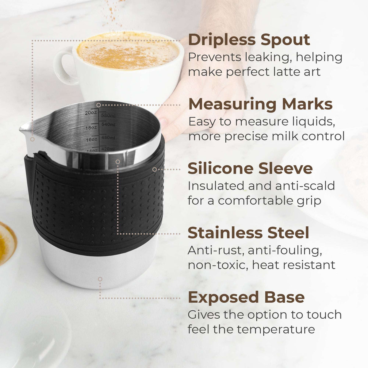 Milk frothing pitcher with black silicone sleeve, dripless spout, and measuring marks