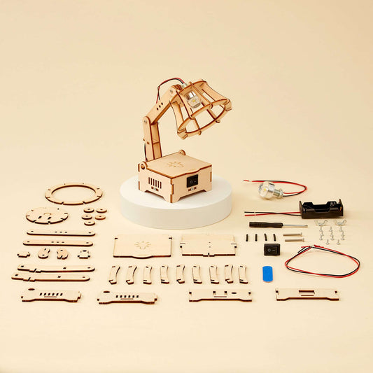 LED lamp DIY kit parts set with wooden pieces, wires, LED components, and circuit board