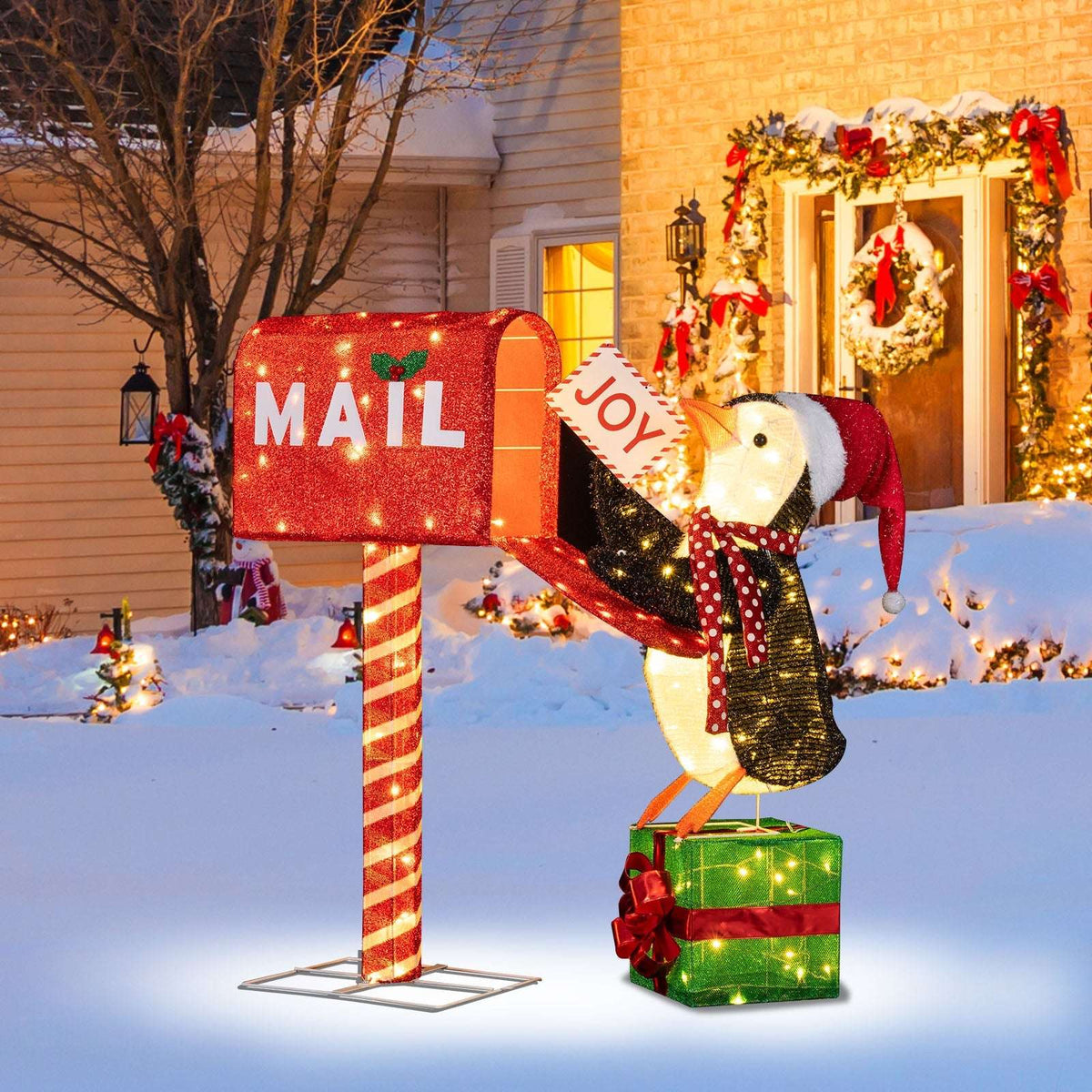 Lighted Christmas mailbox and penguin decoration with red mailbox, striped post, and gift box base