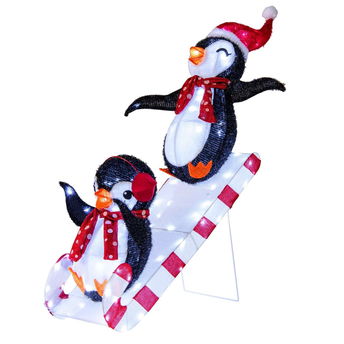 Three-dimensional pre-lit penguin decoration with two penguins on a striped slide