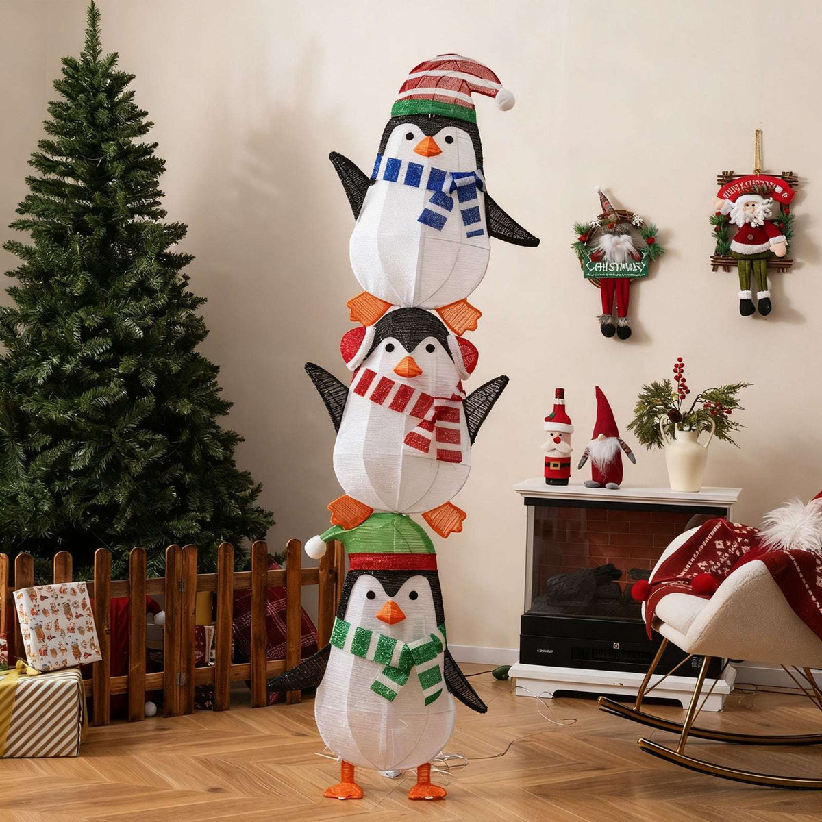 Three stacked fabric penguins with colorful scarves and hats, shown unlit.