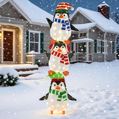 Three-penguin LED decoration glowing with warm white lights.