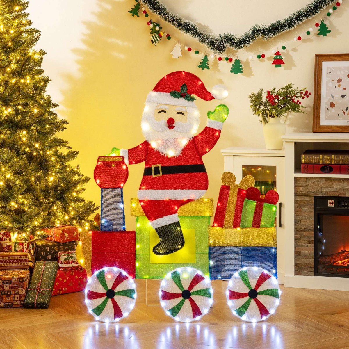 Lighted Santa train decoration with colorful cars, gift boxes and illuminated peppermint wheels