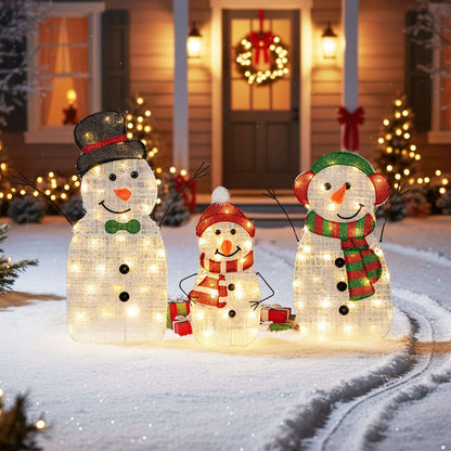 Three illuminated snowmen with festive hats and scarves, arranged as a family set