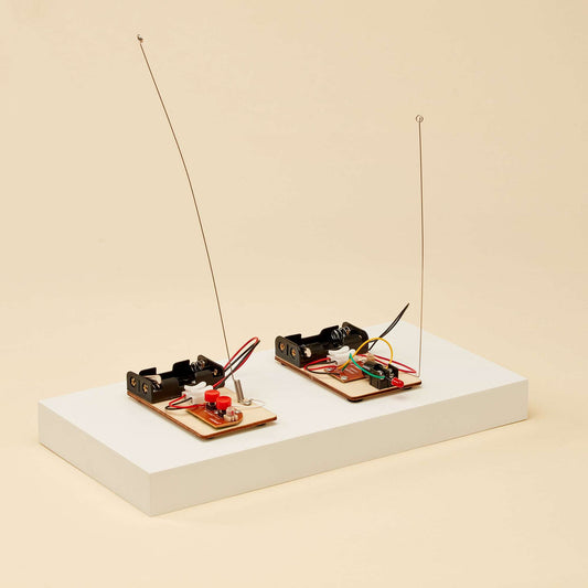 Telegraph and Morse code DIY electronics kit shown on two small circuit boards with wires