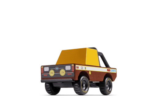 Brown and yellow off-road truck toy with black wheels and Coyote graphic