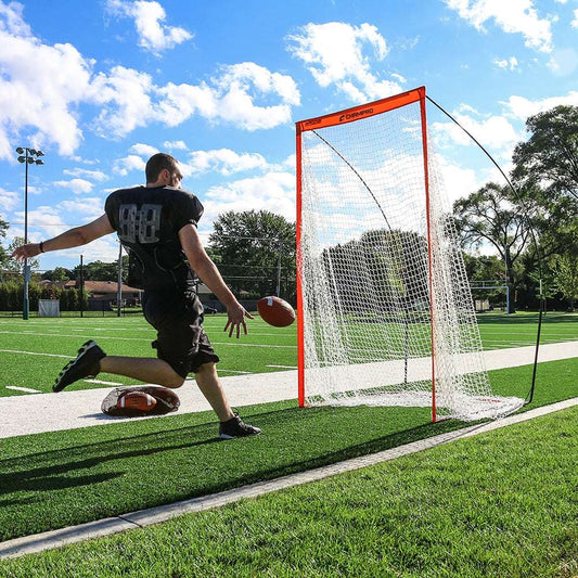 Portable football kicking cage with white net and orange frame