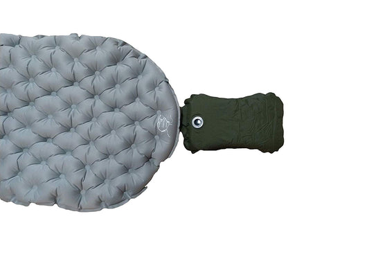 Self-inflating camping pillow with quilted surface, gray, attached green strap