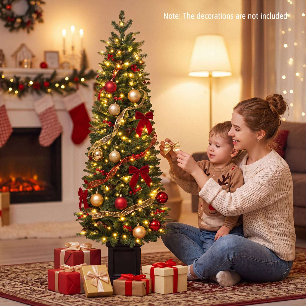 Pre-lit potted Christmas tree decorated with warm white lights, red and gold ornaments, and bows