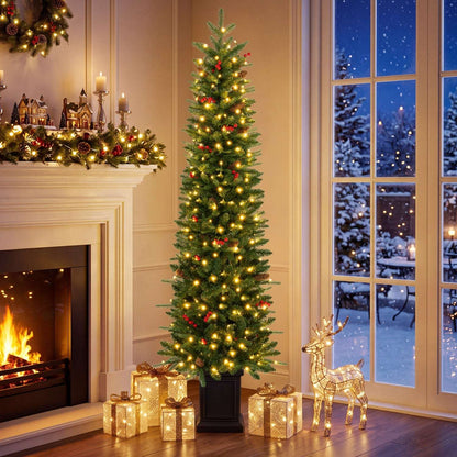 Pre-lit potted Christmas tree with warm white lights and red berry accents
