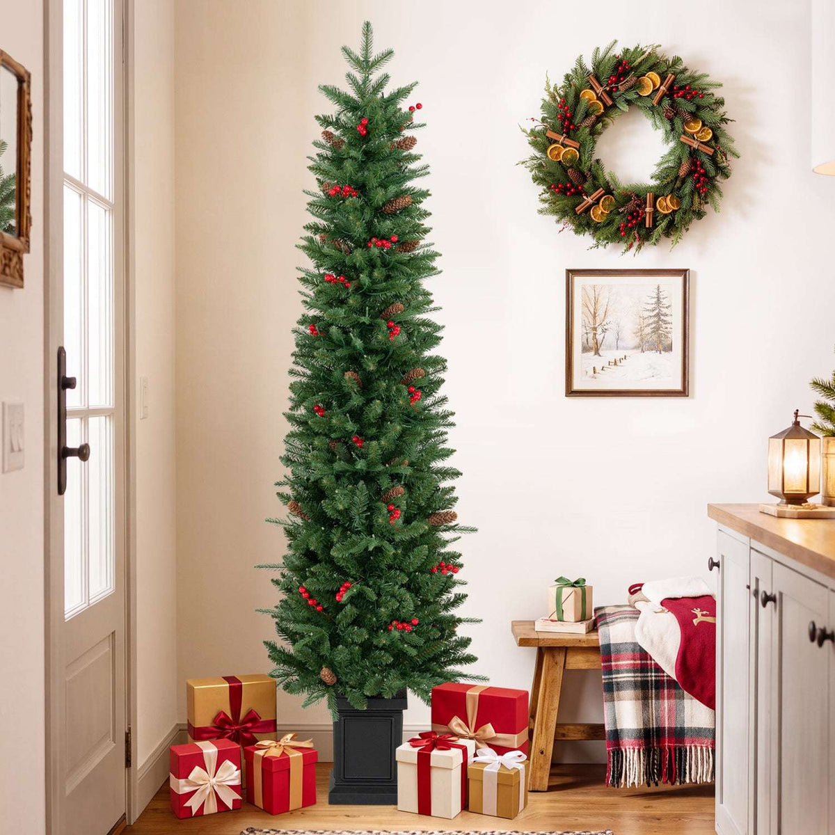Unlit potted Christmas tree with green branches and red berry accents