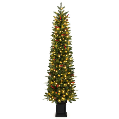 Pre-lit potted Christmas tree with warm white lights and red berry accents