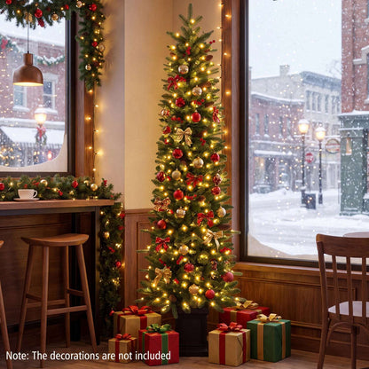 Pre-lit potted Christmas tree decorated with red and gold ornaments and bows