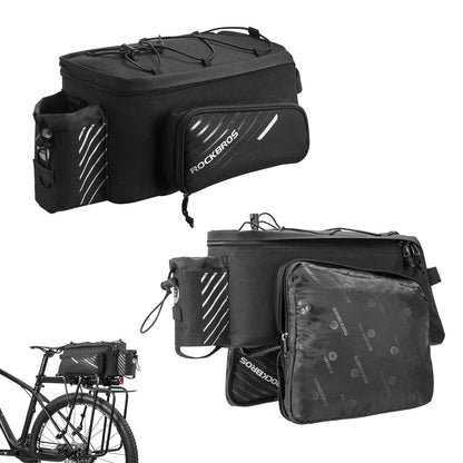 Black bike rack bag on bicycle rack with main compartment and small side zip pockets