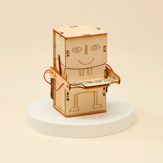 Wooden robot money bank DIY kit with open top and exposed interior parts