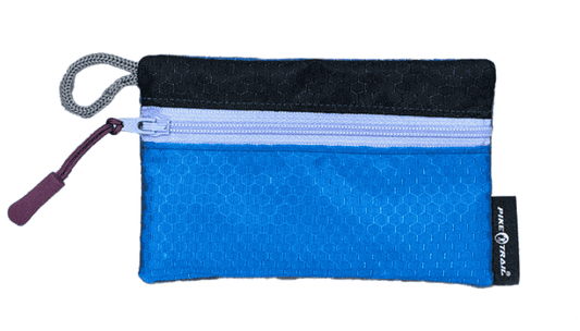Upcycled gaiter wallet with blue body, black top, and light blue zipper