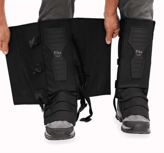 Black snake gaiters with adjustable straps and molded panel on the front.