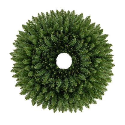 Close-up of a full green artificial Christmas wreath