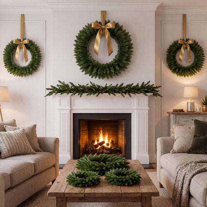 Set of six green artificial Christmas wreaths, shown with gold bows in a living room