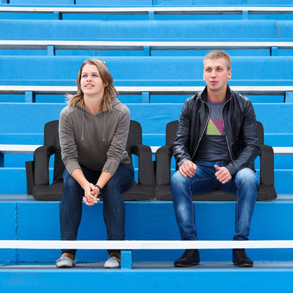 Black adjustable stadium bleacher seats with reclining backrests and arm supports