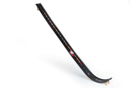 Black ramp and jump track section with orange dashed track markings