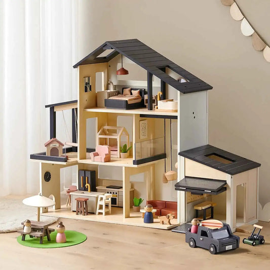 Wooden dollhouse playset with attached garage, open rooms, and black roof details