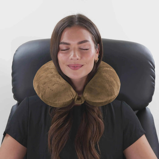 Mocha plush U-shaped neck pillow with chin support, worn around neck