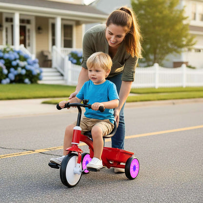 Red toddler tricycle with handlebar and glowing wheels, ridden by child and adult