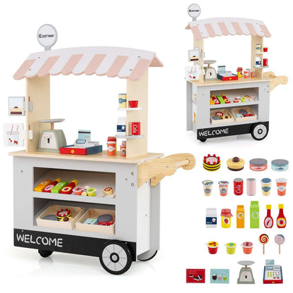 Gray toy market cart with pale pink canopy and black base, shown with included play food and accessories