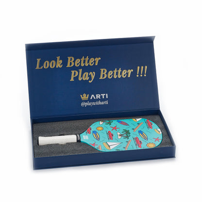 Mint pickleball paddle in open box, tropical face with white grip.