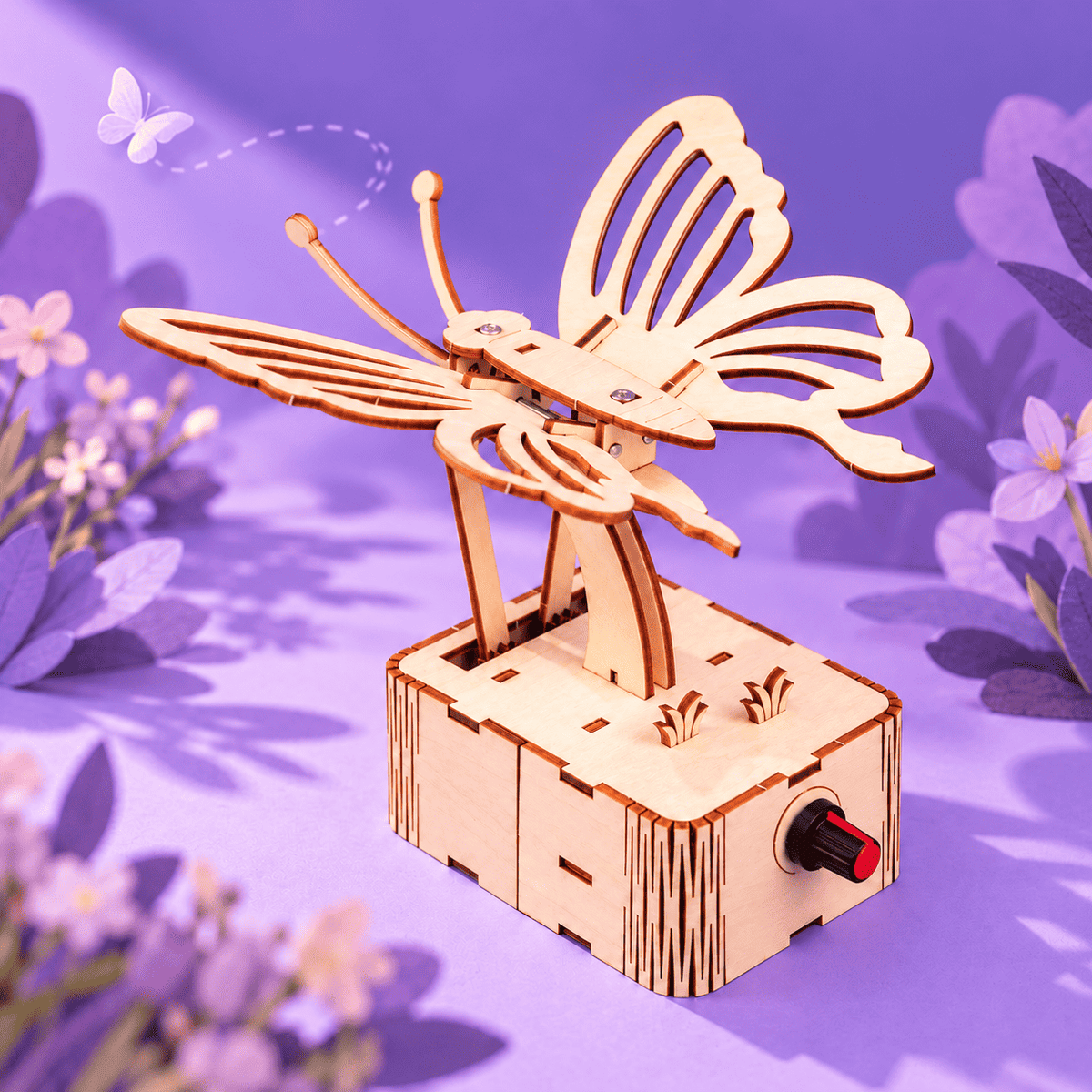 Wooden butterfly mechanical kit with curved wing pieces on a crank base