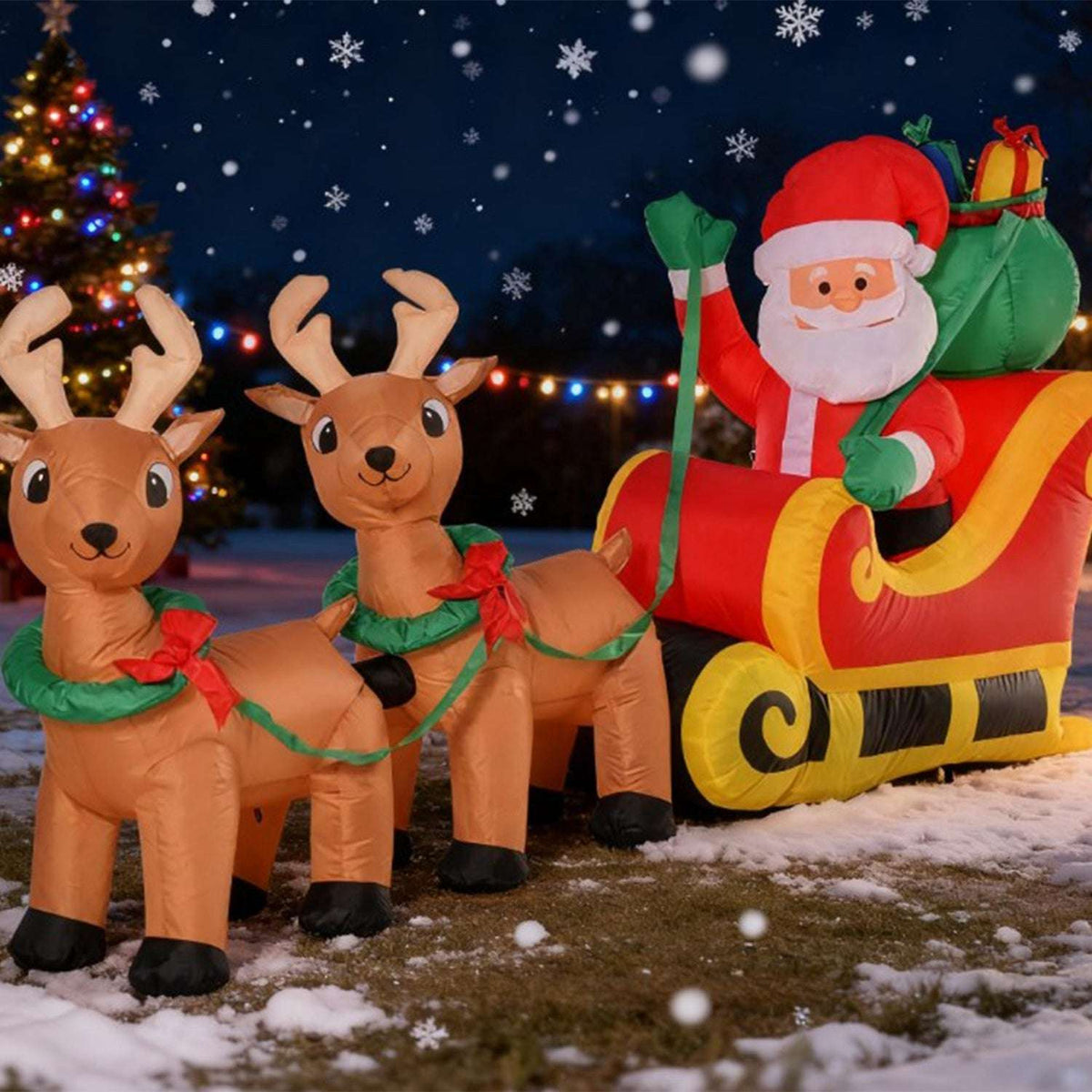 Inflatable Santa sleigh pulled by two reindeer, with Santa holding the reins