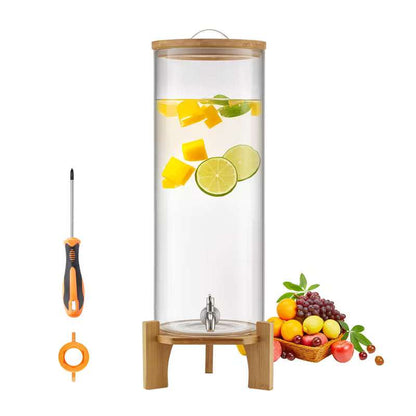 Clear glass beverage dispenser with bamboo stand, metal spigot, with floating citrus slices