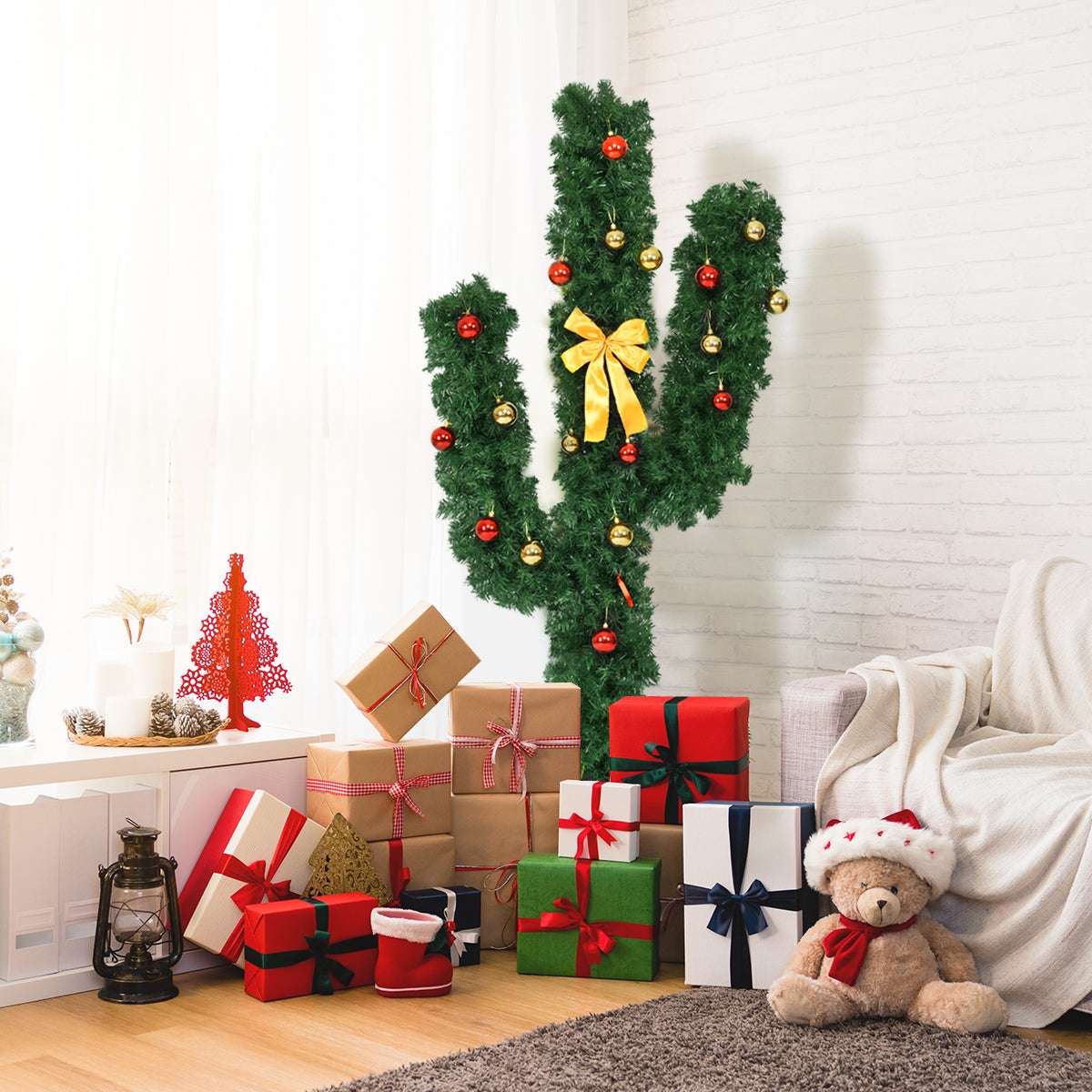 Cactus-shaped artificial Christmas tree with red and gold ornaments and a yellow bow