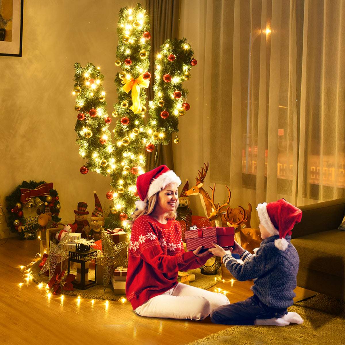 Cactus-shaped Christmas tree illuminated with warm LED lights and decorated with baubles