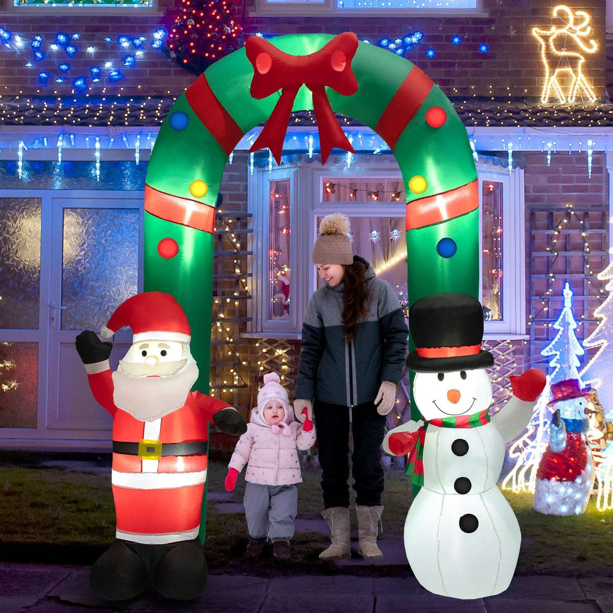 Inflatable Christmas arch with Santa and snowman displayed outdoors