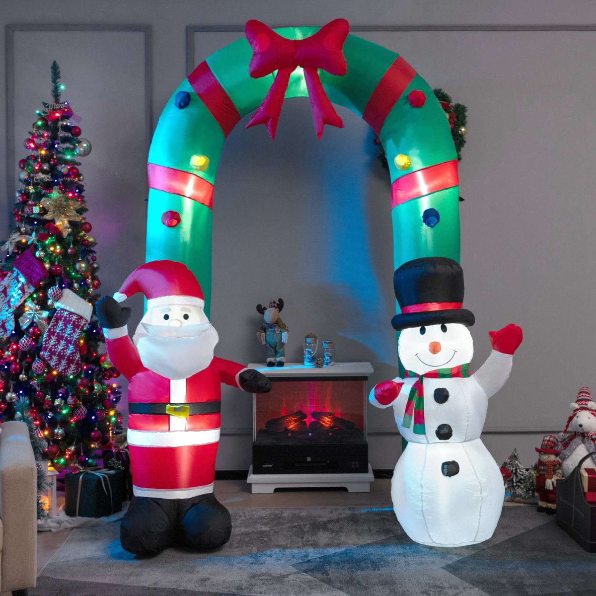 Inflatable Christmas arch with Santa and snowman, shown lit indoors