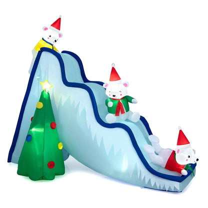 Inflatable Christmas slide shown from the opposite side, with three bears and a lit tree