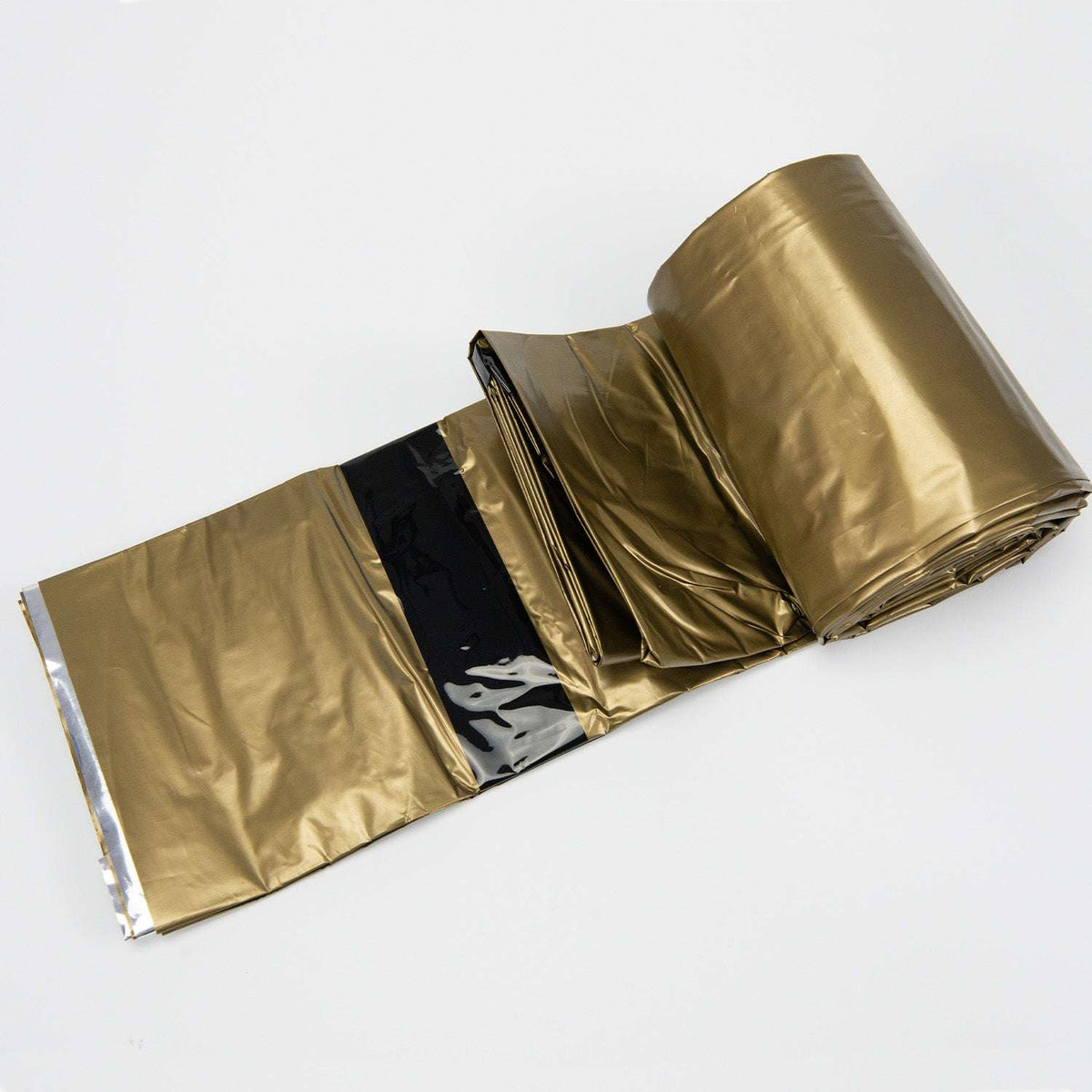Emergency bivvy sleeping bag, flattened reflective foil with gold top, silver bottom, black bands
