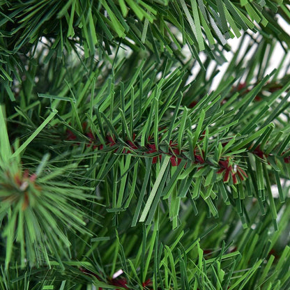 Close-up of green PVC needles and branch ties on the artificial Christmas tree