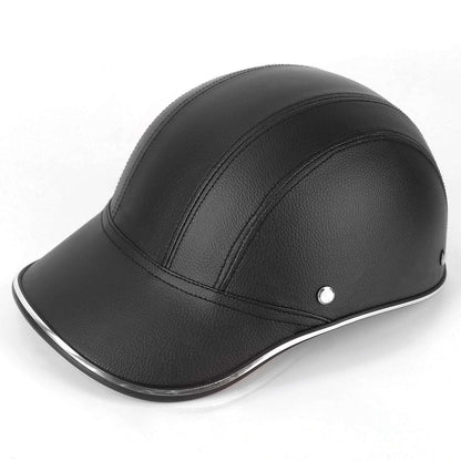 Black leather bicycle helmet cap with curved brim and small metal button detail.