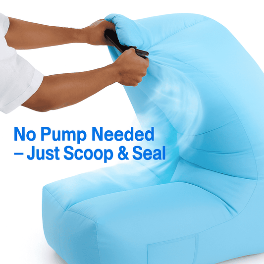 Blue inflatable air lounger chair with hands at the valve opening and seal area.