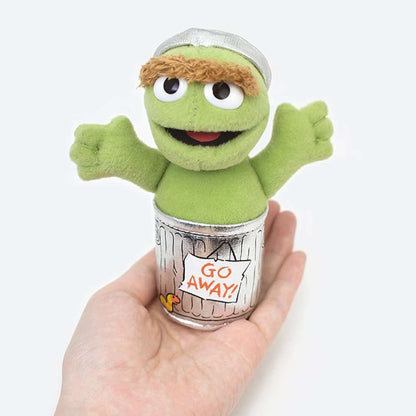 Small Oscar the Grouch plush beanbag held in a hand, front view