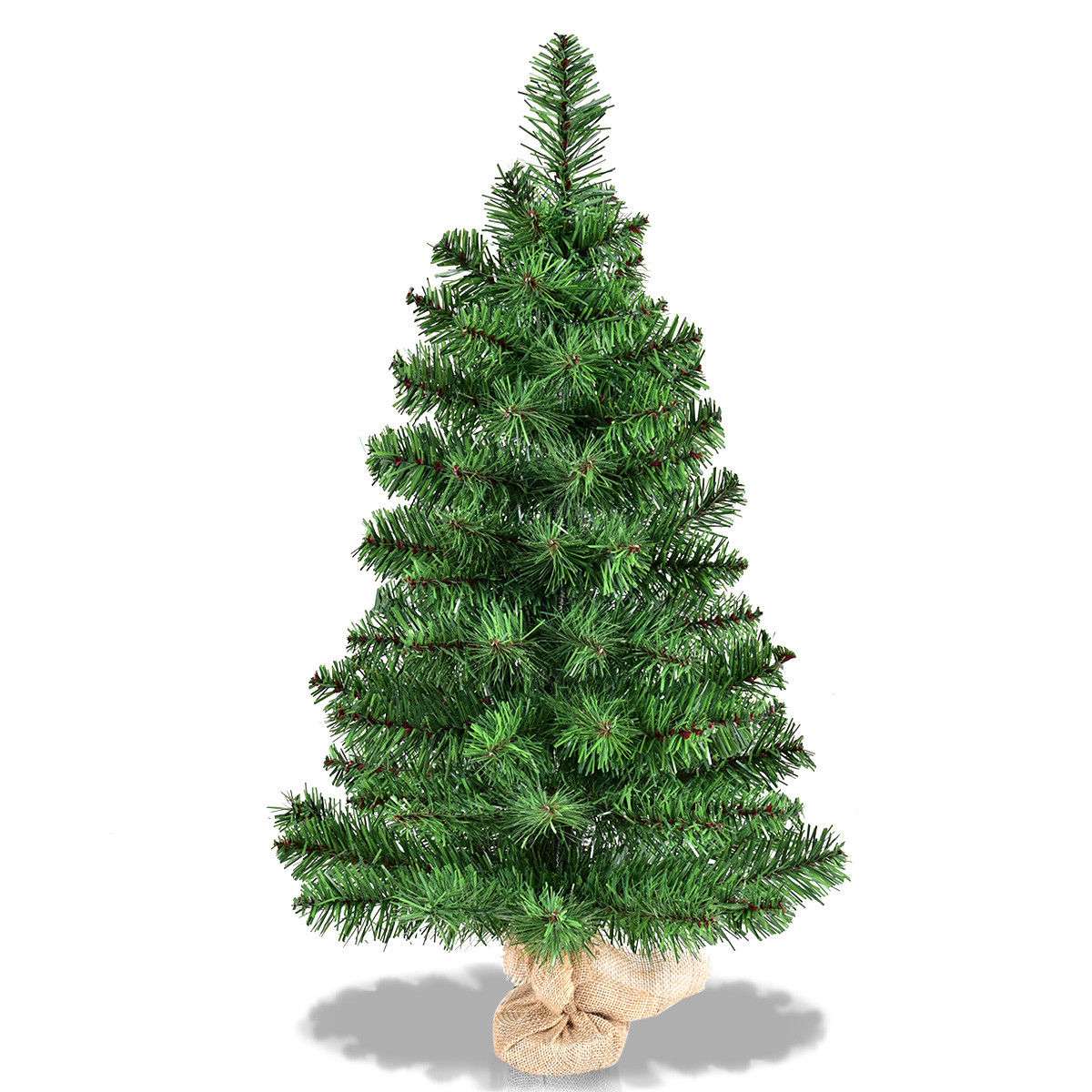 Full view of the green artificial Christmas tree and burlap base