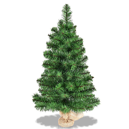 Full view of the green artificial Christmas tree and burlap base