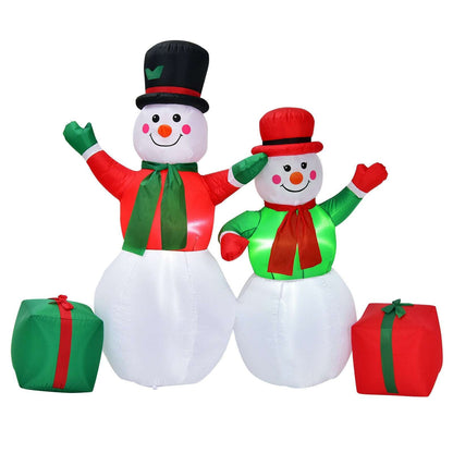 Inflatable snowman pair with red and green outfits, top hats, and gift boxes